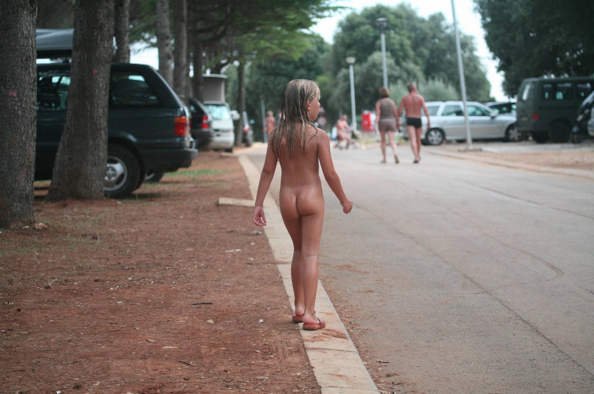 Naturist Child on Sidewalk - 2
