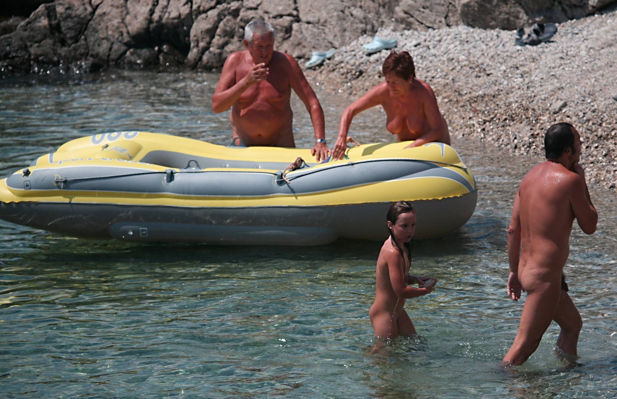 Pure Nudism Images-Lone Nudist in Yellow Boat - 1