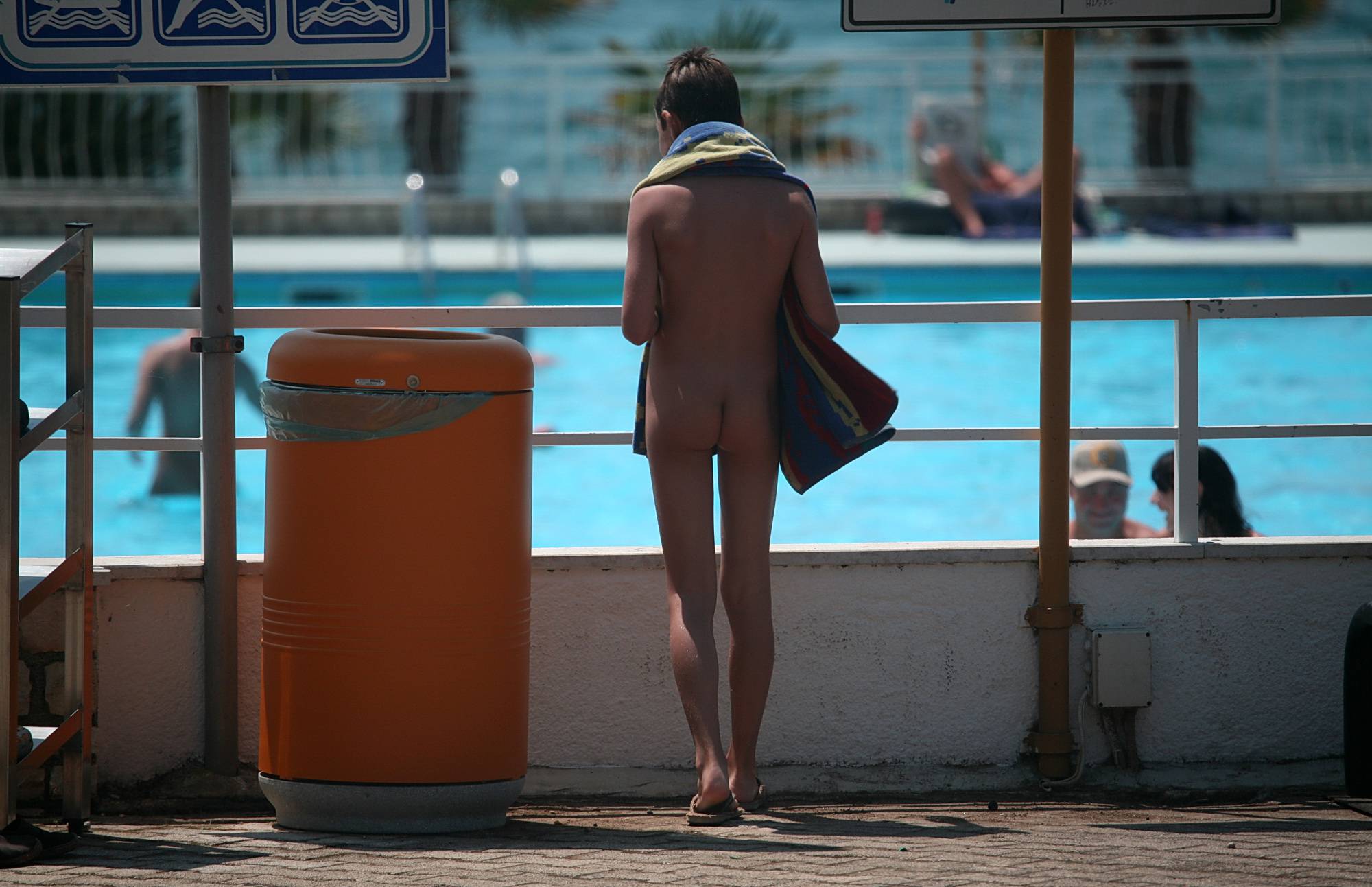 Pure Nudism Images-Walking By The Pool Area - 1