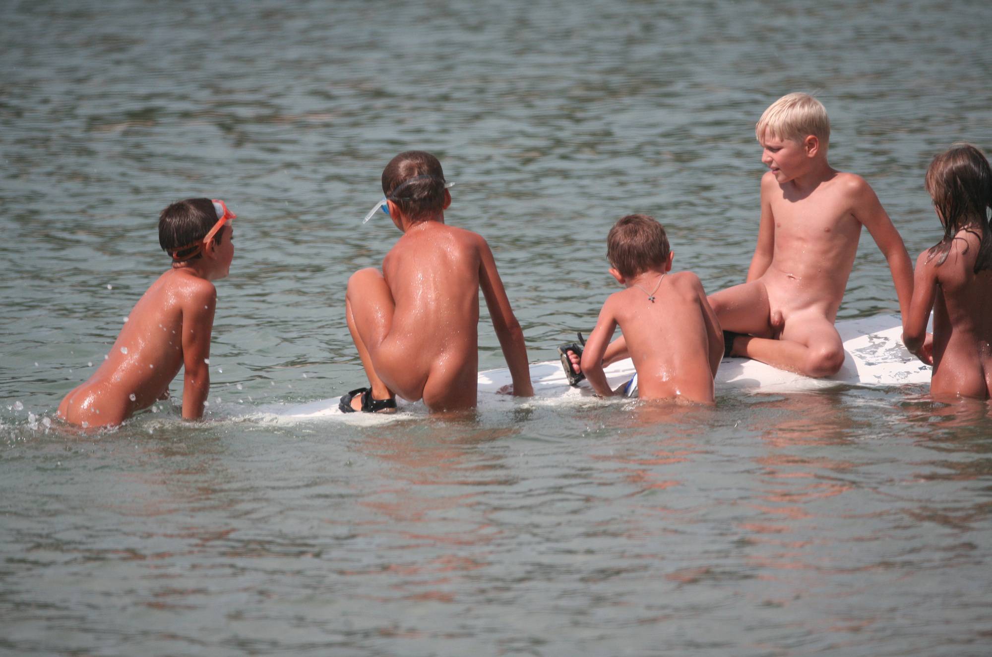 Several Kids On Surfboard - 2