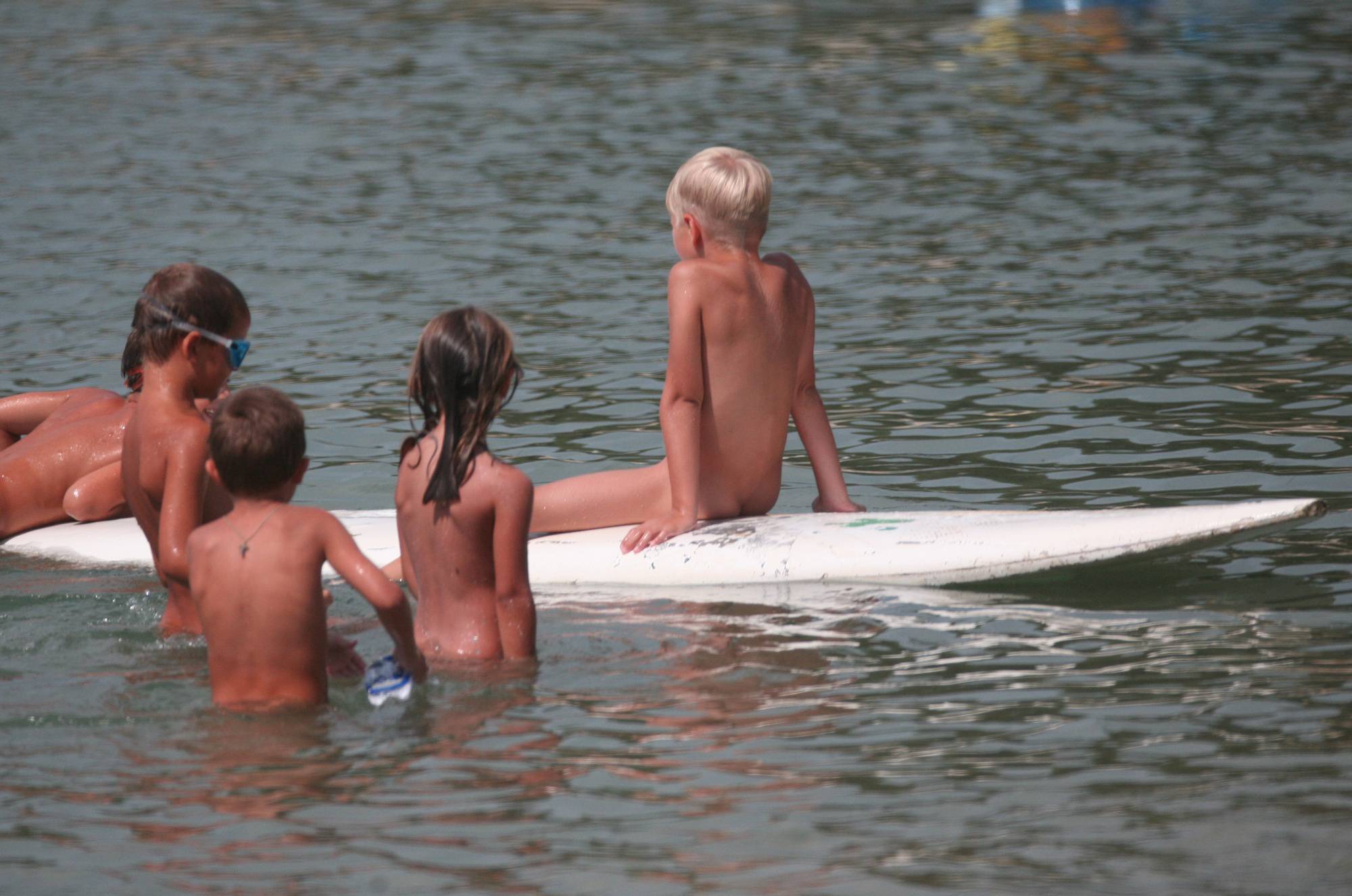 Purenudism Pics-Several Kids On Surfboard - 1